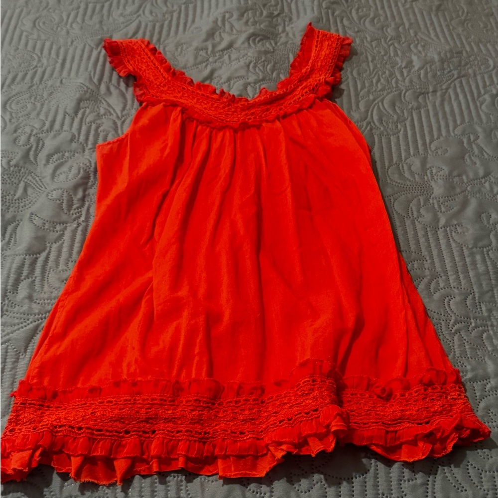 Adorable ruffles tank.  Not bright orange but subtle orange and peach vibes